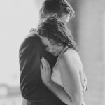 A man and a woman hugging at their wedding